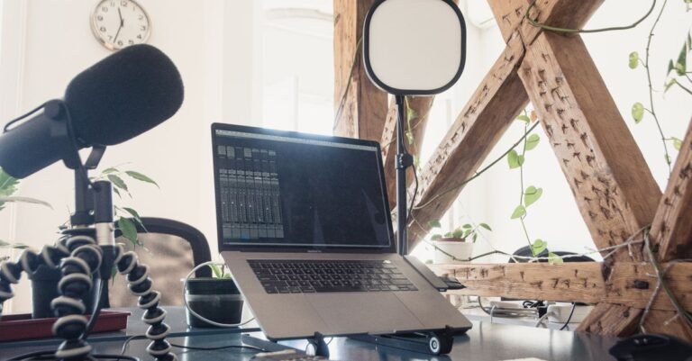 Modern podcast and digital creator setup with microphone and laptop - digital creator workspace